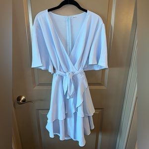 Short sleeved dress with a tier v cut hem